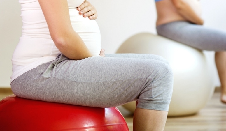 Use a stability ball to ease back pain in pregnancy