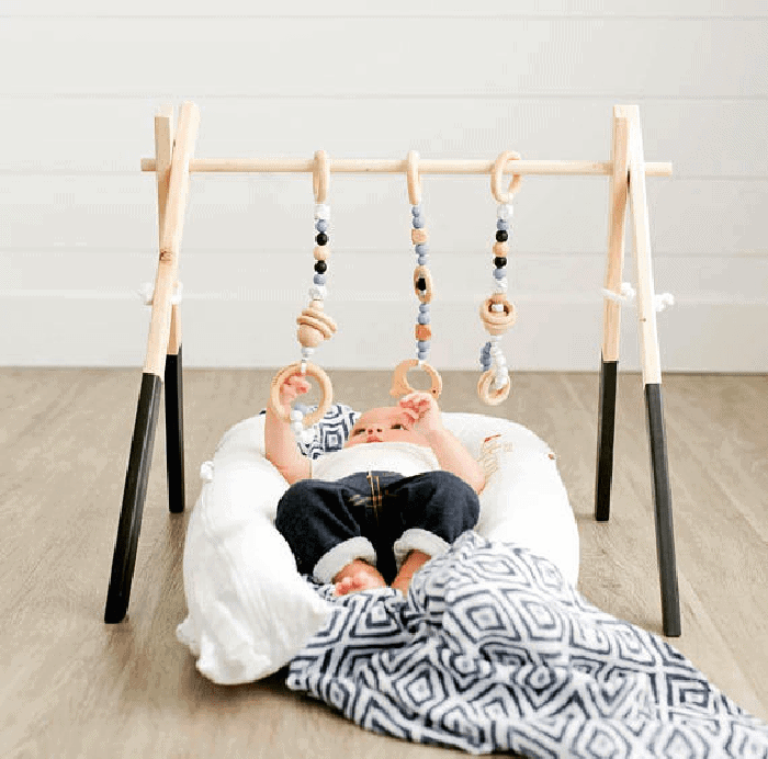 Non toxic wooden baby gym. Super cute gift for a new baby.